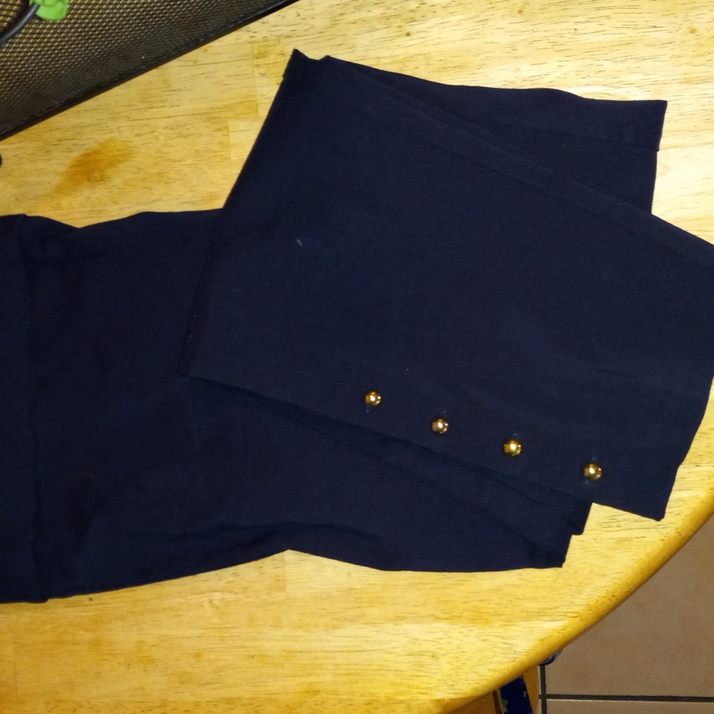 Counterparts pants detail  gold button on each leg